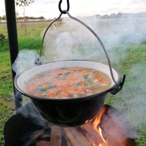 Soup by open fire